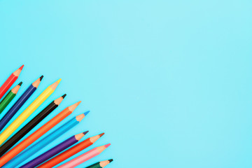 Colored pencils. A set colored pencils isolated on a blue background.