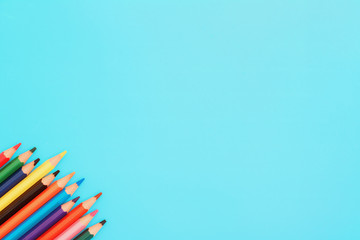 Colored pencils. A set colored pencils isolated on a blue background.