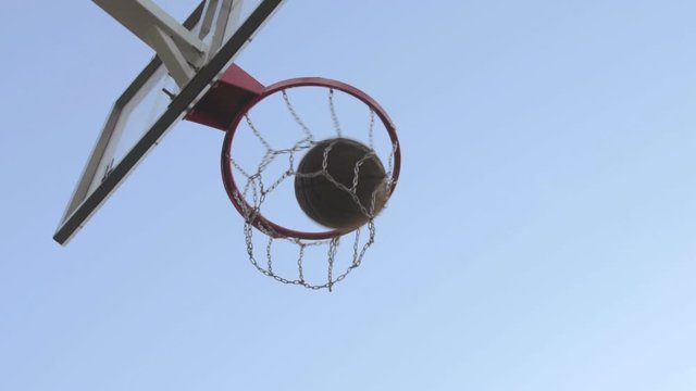 Low angle view of Caucasian basketball player playing basketball in basketball court