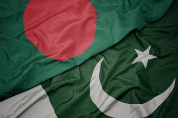 waving colorful flag of pakistan and national flag of bangladesh.