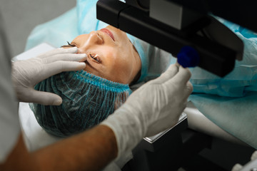 Nice adult woman having a laser treatment procedure