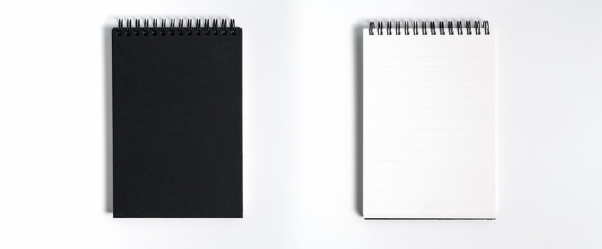 Notebook mock up with clean black blank for design and advertising. Notepad with chromed spring and free copy space template. On the gray background.