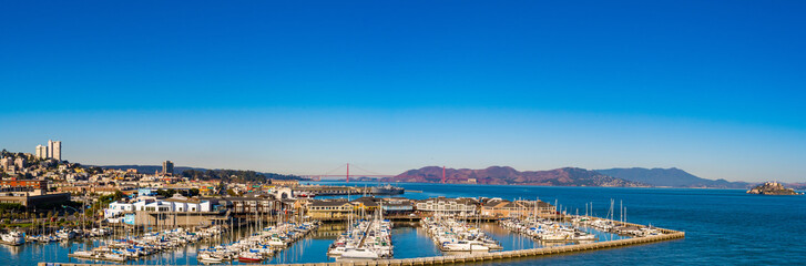 Panorama cityscape skyline view with Golden Gate Bridge, Alcatraz and buildings. Yachts and boats...