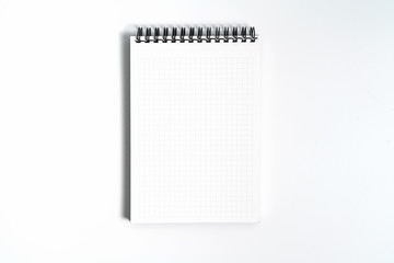 Notebook mock up with clean black blank for design and advertising. Notepad with chromed spring and free copy space template. On the gray background.