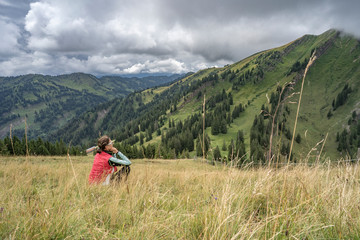 senior woman hiking in autumnal atmosphere on the ridge of the Nagelfluh chain near Oberstaufen,...