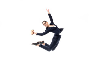 graceful businesswoman holding paper cup while dancing isolated on white