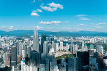 Kuala Lumpur, Malaysia. 13 February 2019: Kuala Lumpur city skyline with garden, Malaysia Bright blue sky