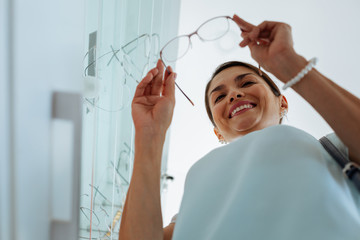 Low angle of a happy positive brunette woman