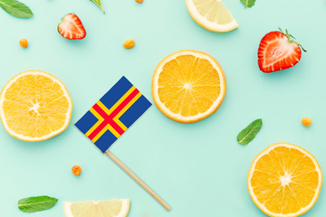 Aland Islands Paper Stick Flag. National summer fruits concept, local food market. Vegetarian theme.