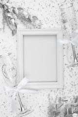 Flat lay of white wedding frame