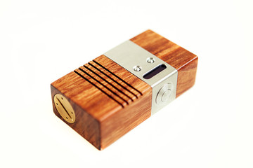 Vaping mod in wooden box isolated in white background