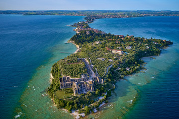 Morning photography with drone. Grotte di Catullo, Sirmione Lake Garda Italy. - obrazy, fototapety, plakaty