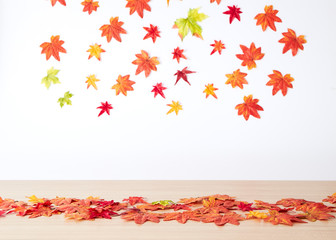 Autumn maple leaves on wooden table