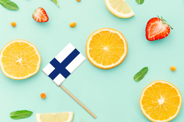 Finland Paper Stick Flag. National summer fruits concept, local food market. Vegetarian theme.