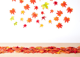 Autumn maple leaves on wooden table