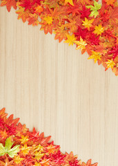 Naklejka na ściany i meble Autumn leaves on a wooden table