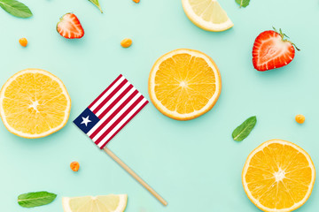 Liberia Paper Stick Flag. National summer fruits concept, local food market. Vegetarian theme.