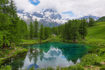Fototapeta na wymiar Summer alpine landscape on the Blue Lake (Lago Blu) near Breuil-Cervinia, Aosta Valley, Italy