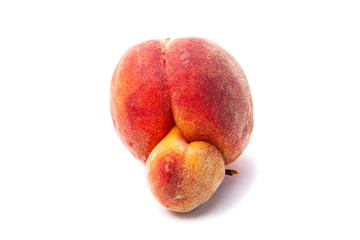 Trendy ugly food. Peach fruit isolated on white background. Misshapen produce, food waste problem...