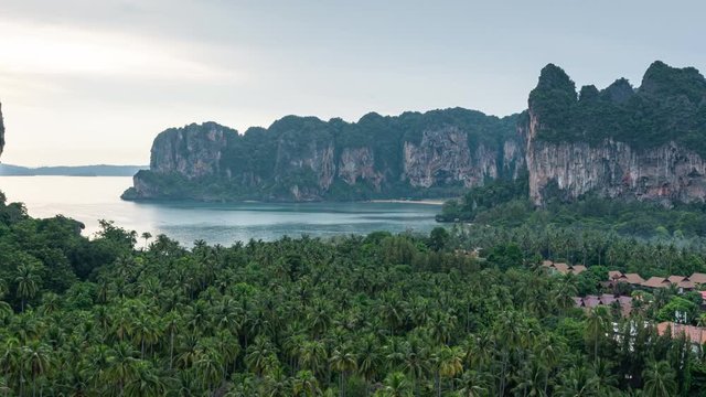 railay viewpoint on sunset time, a little town with green coconut garden and mountain background
