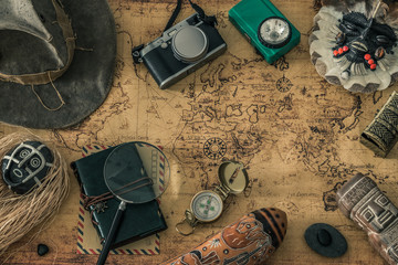 a map with a travel notebook and travel equipment in a retro style. Journey plan