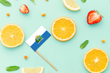 San Marino Paper Stick Flag. National summer fruits concept, local food market. Vegetarian theme.