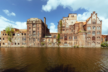 Fototapeta na wymiar Szczecin. Old abandoned factories on the bank of the Odra river in the old part of town