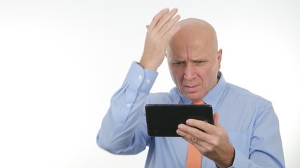 Businessman Gesturing Nervous and Unhappy After Reading Bad Message on Table