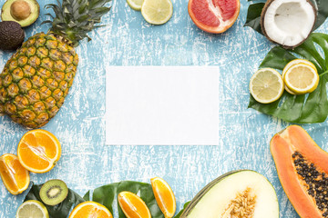 White card surrounded by exotic fruits
