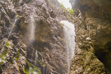 Waterfalls and rivulets rustle out of the crevices and joints at the side of the Höllental Klamm...