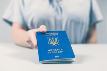 Immigration and passport control at the airport. woman border control officer with Ukrainian...