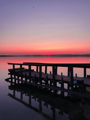 Obraz premium Empty wooden bridge at sunset. Soft sunlight