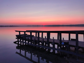 Obraz premium Empty wooden bridge at sunset. Soft sunlight