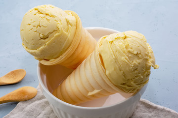 Homemade organic vanilla ice cream on a light background