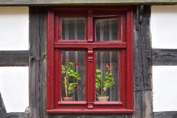 Window of old ethno house in The Folk Culture Museum in Osiek by the river Notec. Poland, Europe