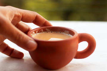 Tea served in a traditional clay cup