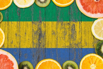 Gabon food concept. Fresh fruits from traditional gardens. Cooking concept on wooden flag...