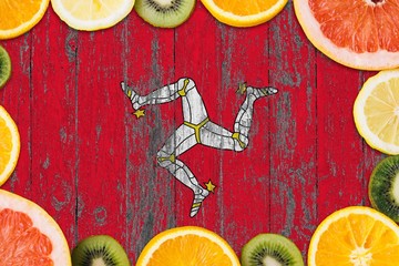 Isle Of Man food concept. Fresh fruits from traditional gardens. Cooking concept on wooden flag...