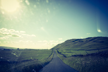 Scotland,  a road in clouded landscape in Summer