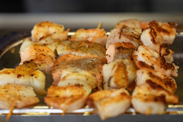 Salmon fish and shrimps sea food barbecue.
