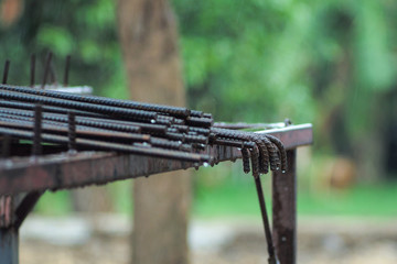 Selective focus on reinforced steel lines put on the metal station