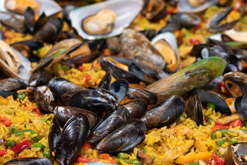 Sea food, paella with mussels and rice dish, background