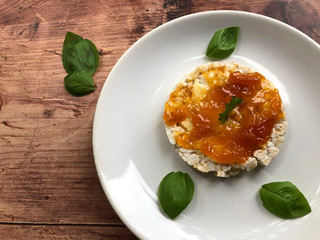 Healthy rice waffles, crispbread or puffed rice snack with apricot jam. Healthy sweet vegetarian snack, dessert or breakfast.