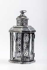 Beautiful vintage metal lantern on a white background