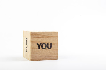 Wooden cubes with the inscription you on a white background