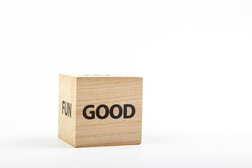 Wooden cubes with the inscription good on a white background