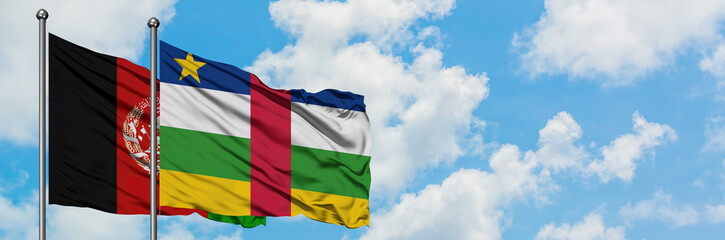 Afghanistan and Central African Republic flag waving in the wind against white cloudy blue sky...