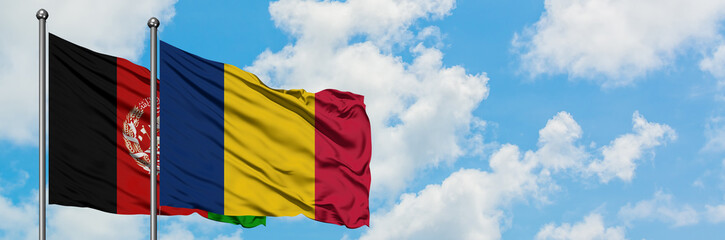 Afghanistan and Chad flag waving in the wind against white cloudy blue sky together. Diplomacy...