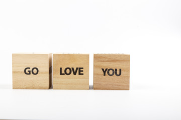 Wooden cubes with the inscription Go Love You on a white background