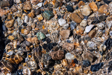 Pebbles as seen under the waters in a small stream near Salt Lake City, UT